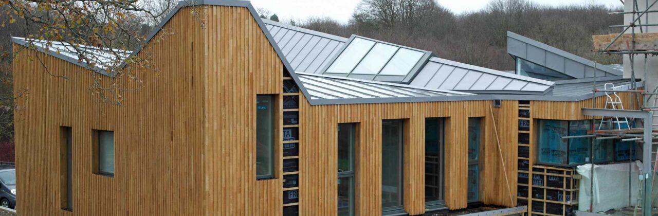 Modern new-build design with large zinc roof in Hadlow Down