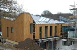 Modern new-build design with large zinc roof in Hadlow Down