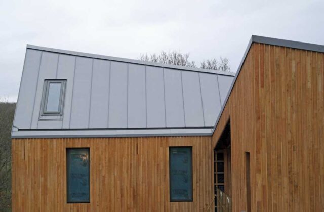 Modern new-build design with large zinc roof, i8n Hadlow Down, East Sussex