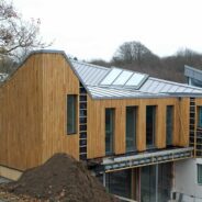 Modern new-build design with large zinc roof in Hadlow Down